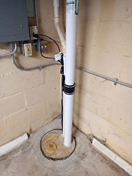 Brookfield Radon - Outside Installation of Radon Mitigation system using the sealed sump pump crock to tap into drain tile