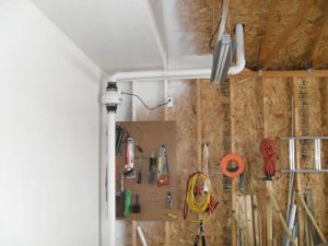 Radon Mitigation System in Garage by Brookfield Radon Mitigators 17145 W Bluemound Rd j100, Brookfield, WI 53005 262-955-6696